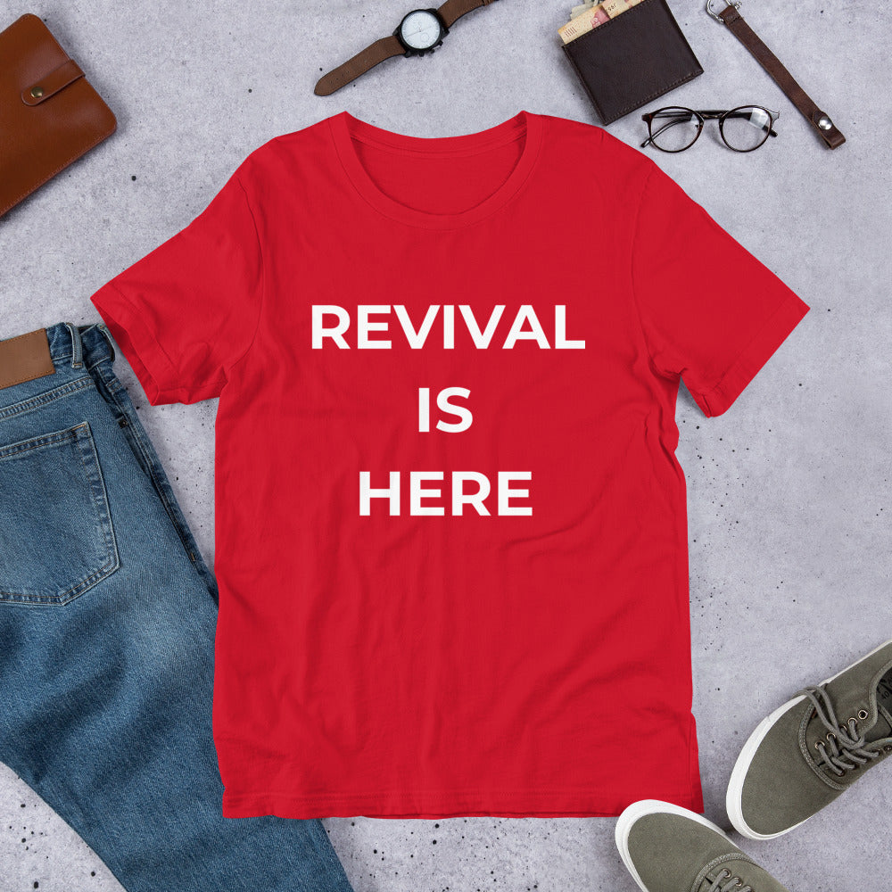Flat lay of black heather unisex Christian revival t-shirt with βRevival Is Hereβ text design