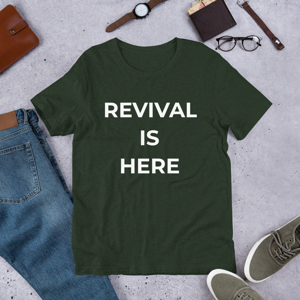 Flat lay of black heather unisex Christian revival t-shirt with “Revival Is Here” text design
